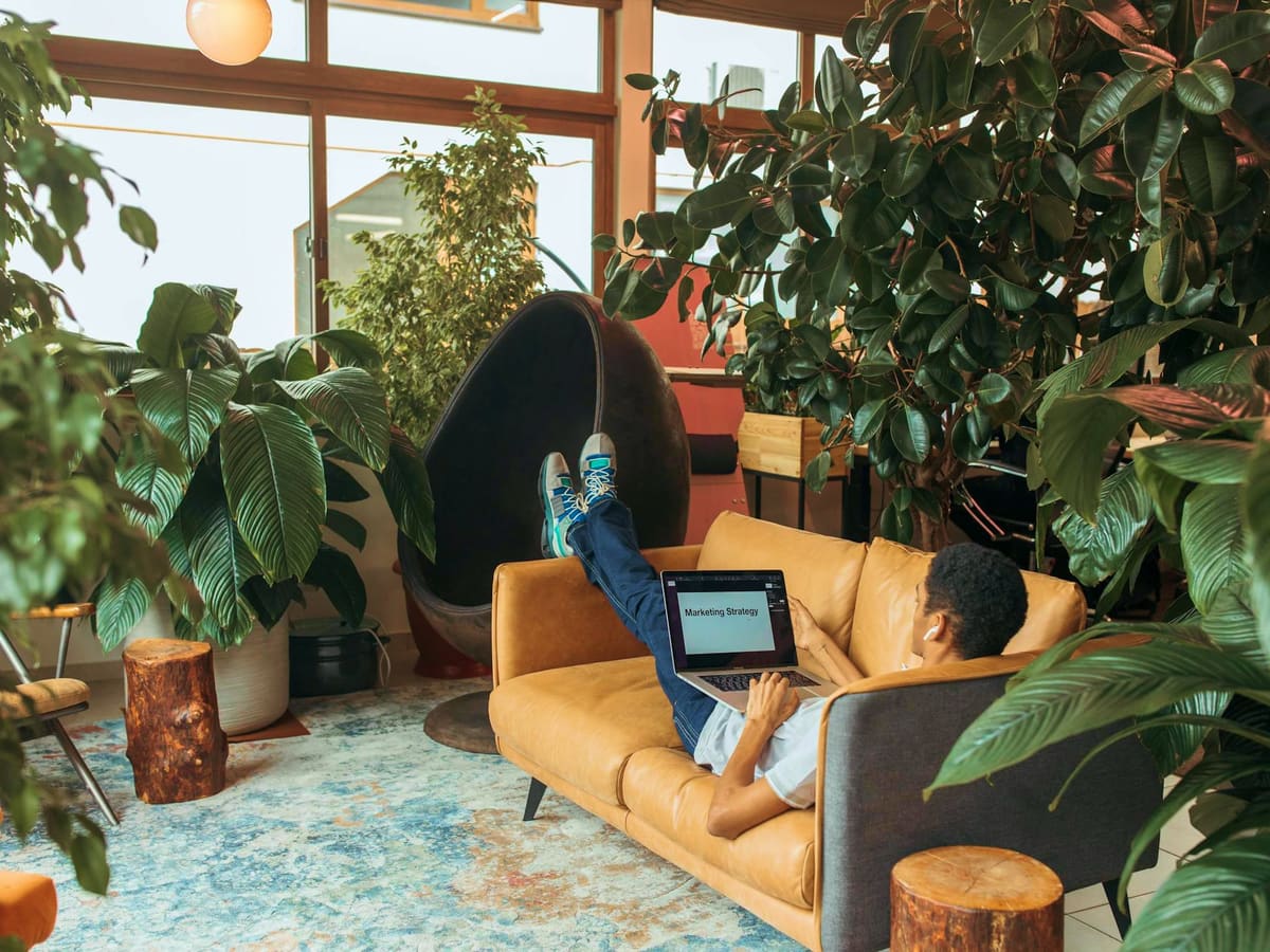 A warm editorial photograph of a teenager studying with gentle support nearby.
